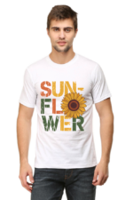 A man wears Product, a white T-shirt with "SUNFLOWER" in bold colourful letters and a large sunflower graphic as the O, standing against a plain light background.